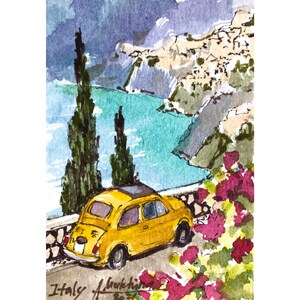 May include: A watercolor painting of a yellow Fiat car parked on a cliff overlooking a turquoise ocean. The car is facing away from the viewer, and the cliff is covered in green trees and bushes. The painting is signed "Italy" in the bottom left corner.