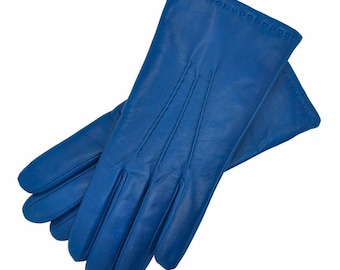 May include: A pair of blue leather gloves. The gloves are made of soft, supple leather and have a classic design.