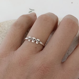 Triple Skull ladies ring in sterling silver, 3 spooky skulls on a straight band silver ring, Gothic and Punk skeleton jewellery for her,