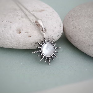 May include: A trio of ceramic mugs with a speckled, matte finish in cream, light grey, and dark grey. Each mug features a simple, minimalist design and a rounded handle. Suitable for tea or coffee, these mugs offer a modern aesthetic.