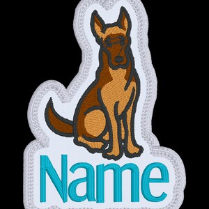 May include: A cartoon brown and black dog sitting with its tail curled. The dog is on a white background with a white border. The word "Name" is written in blue below the dog.