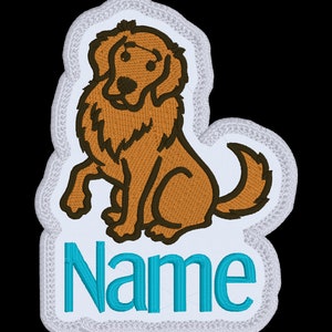 Könnte beinhalten: Weißer Bügel-Patch mit einem braunen Cartoon-Hund, der mit erhobenem Pfoten sitzt. Der Hund hat eine braune Nase und schwarze Augen. Der Text "Name" ist in türkisblau unter dem Hund.