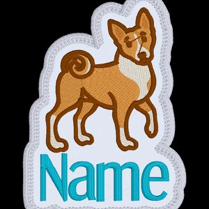 May include: White embroidered patch featuring a brown and white Basenji dog illustration and the word "Name" in turquoise blue.