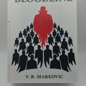 May include: A white book cover with the title "THE BLOODLINE" in gray letters. A red silhouette of a figure stands above a crowd of black silhouettes. The author's name, V. R. Markovic, is printed at the bottom.