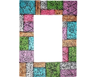 May include: A colorful picture frame made of wood with a patchwork design. The frame is made up of different colored squares with intricate patterns. The frame is perfect for displaying a photo or artwork.