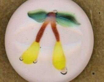 Fruit yellow brown stem and green leaves Paperweight Button by John Gooderham rare pink glass base signed onback metal shank studio 3/4" med