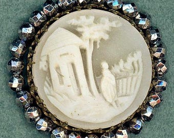 Cameo carved house tree fence lady helmet shell scene pictorial architecture foilage people round 1" claw set in white metal two tone shell