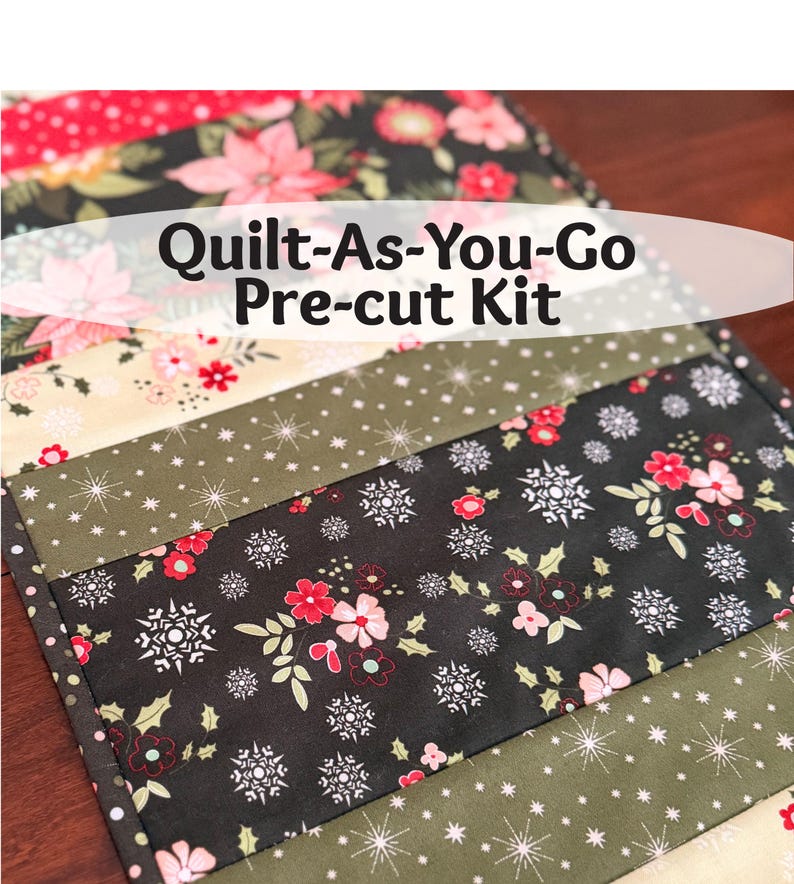 May include: A pre-cut quilt kit with a variety of patterned fabrics. The kit includes fabrics with floral, snowflake, and dotted designs in colors like red, black, green, and cream. The text "Quilt-As-You-Go Pre-cut Kit" is displayed.