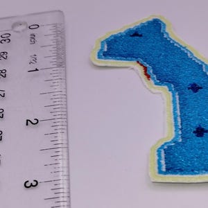 May include: A set of three ceramic mugs with a speckled, matte finish. The mugs are in shades of cream, light gray, and dark gray. Each mug has a simple, minimalist design, perfect for coffee or tea.