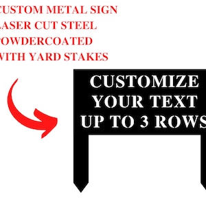May include: Black metal sign with white text that reads "CUSTOMIZE YOUR TEXT UP TO 3 ROWS". The sign is attached to two black metal stakes.