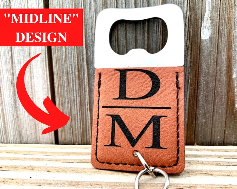 May include: A stainless steel bottle opener with a brown leatherette cover. The cover features the initials "DM" in black, with a key ring attached. The text "MIDLINE DESIGN" is in a red box.