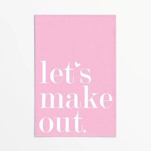 May include: Pink card with the text "let's make out." in white font.
