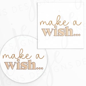 May include: Two white circles with the text "make a wish..." in brown script. The word "wish" is in a larger, bold font with a brown outline.