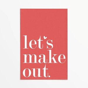 May include: A red card with white text that reads "let's make out."