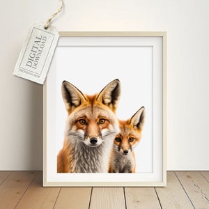 May include: A digital download of a printable art print featuring a close-up of a red fox and a smaller red fox cub. The foxes are looking directly at the viewer against a white background.