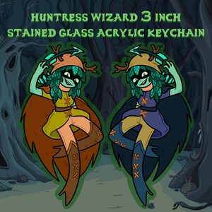 May include: A 3 inch stained glass acrylic keychain featuring a green and brown character with antlers, a green mask, and a yellow and purple outfit. The character is holding a bow and arrow. The background is a dark green forest.