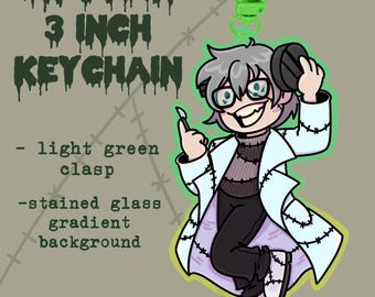 May include: A 3 inch keychain featuring a cartoon character in a white lab coat with stitched details. The character has grey hair, a black turtleneck, and is holding a scalpel. The background is a stained glass gradient. The keychain has a light green clasp.