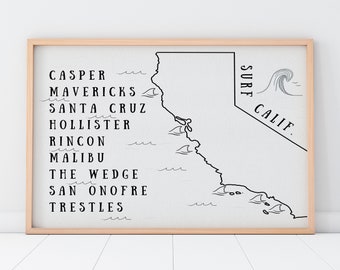 May include: A framed wall art print featuring a black line map of California on a white background. The text lists surf spots including Casper, Mavericks, Santa Cruz, Hollister, Rincon, Malibu, The Wedge, San Onofre, and Trestles, with the text SURF CALIF.