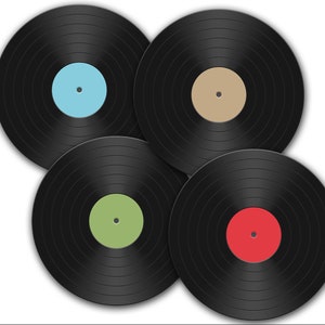 May include: Four black vinyl records with different colored labels. The labels are light blue, beige, light green, and red.