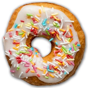 May include: A glazed donut with colorful sprinkles. The donut is a light brown color and has a white frosting with multi-colored sprinkles.