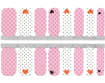 May include: Nail art strips with a pink polka dot pattern, alternating with white strips with black polka dots. Some strips feature small orange or black heart designs. The strips are on a silver backing.
