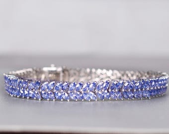 Pulseira de tênis com tanzanita em formato de marquise, joia em prata de lei com pedra do mês de nascimento.
