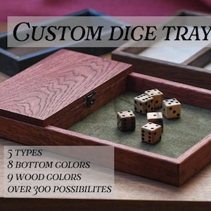 May include: A custom dice tray with a hinged lid, open to reveal dice on a green felt surface. The tray is made of reddish-brown wood. Text on the image reads "CUSTOM DICE TRAY" and details about customization options.