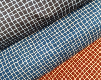 May include: Three fabric swatches with a grid pattern. The top swatch is black with a white grid, the middle swatch is blue with a white grid, and the bottom swatch is orange with a white grid.