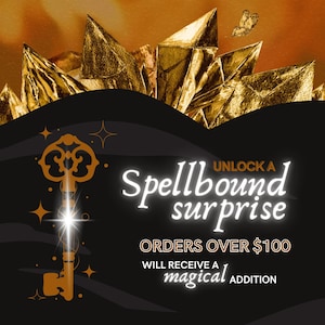 May include: A golden key with a glowing light emanating from it, surrounded by gold crystals. The text "UNLOCK A Spellbound surprise ORDERS OVER $100 WILL RECEIVE A magical ADDITION" is displayed on a black background.