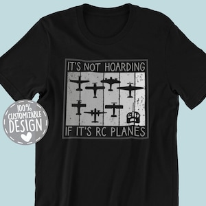 May include: Black t-shirt with a white graphic of a row of RC airplanes and the text "It's not hoarding if it's RC planes".