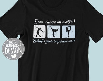May include: Black t-shirt with a white graphic of three ice skaters. The text "I can dance on water! What's your superpower?" is printed on the shirt.