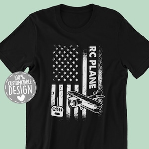 May include: Black t-shirt with a white graphic of a plane flying over an American flag. The text "RC PLANE" is on the right side of the flag.