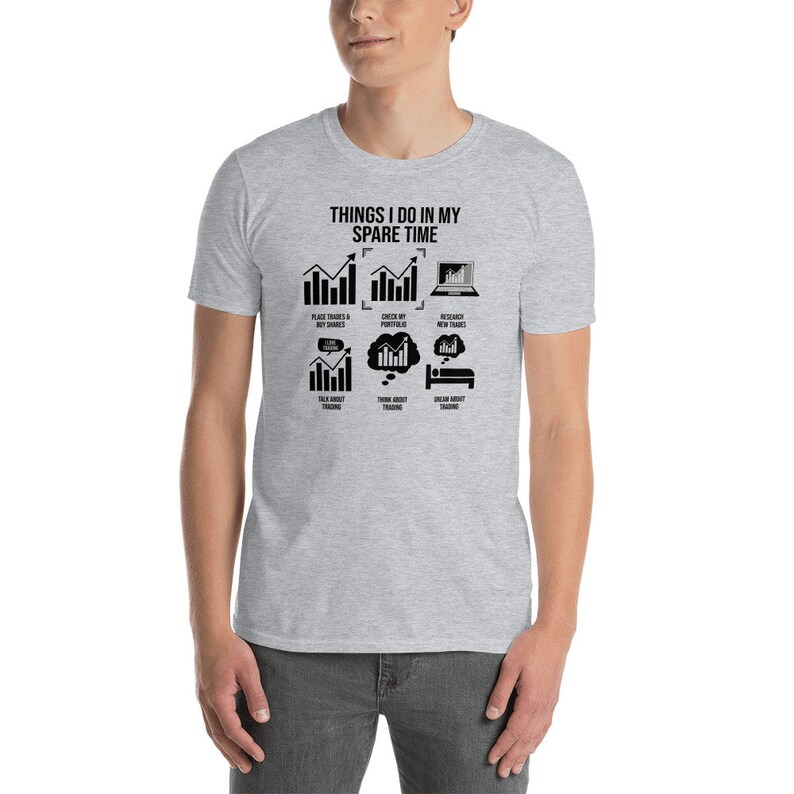 May include: A grey t-shirt with a black graphic that says "Things I do in my spare time" and shows a series of charts and icons related to trading.