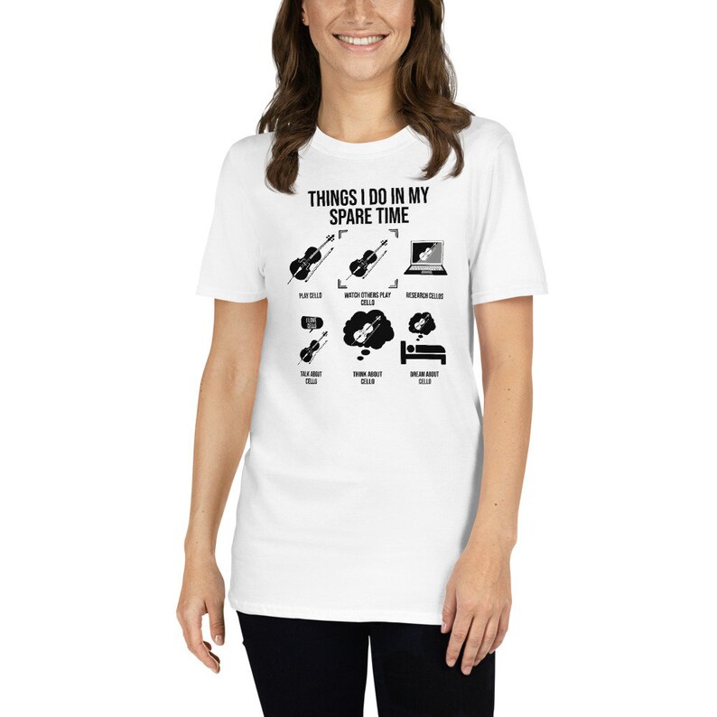 May include: White t-shirt with a black graphic that says "Things I do in my spare time" and shows a series of illustrations of a cello, including playing, watching others play, researching, talking about, dreaming about, and sleeping.