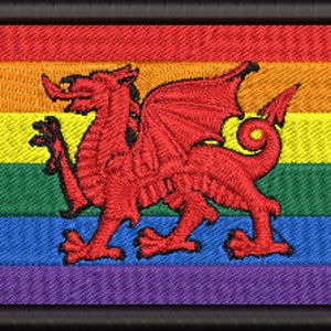 May include: A rainbow pride flag with a red dragon in the centre. The dragon is a symbol of Wales.
