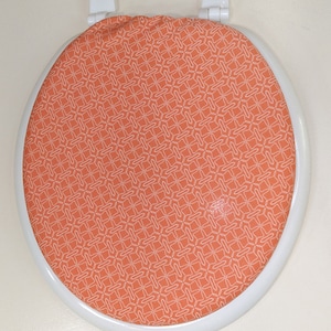 Toilet Seat Lid Covers : Bathroom Decor idea. Standard size toilet seat. Orange bathroom idea. Stretchy cloth lid covers.