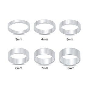 May include: Six silver rings of different widths, from 3mm to 8mm. The rings are all plain and smooth.
