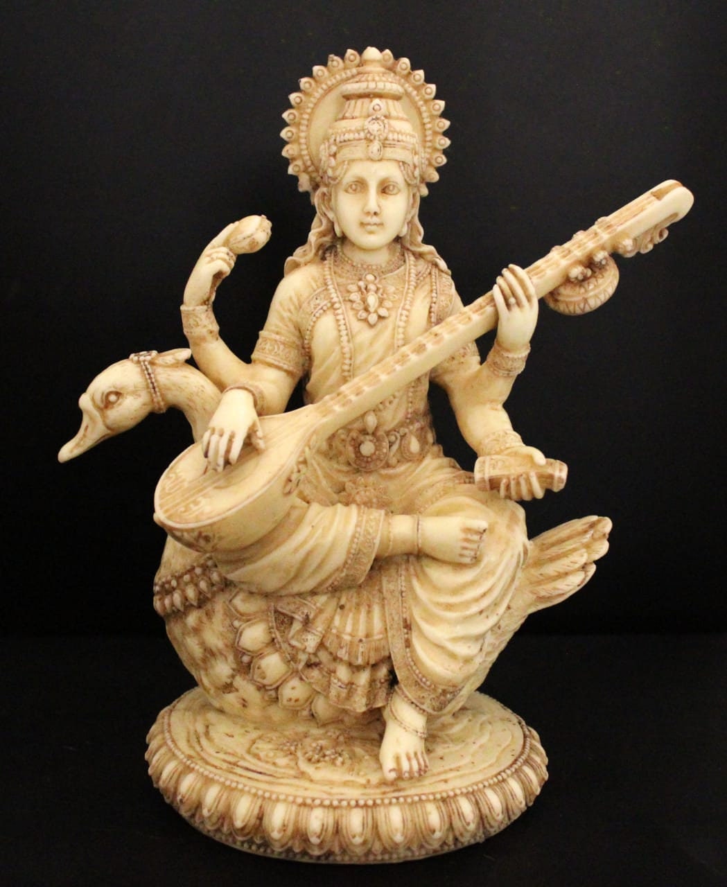 Goddess Saraswati statue # sitting on a swan with Veena # Indian god figure 