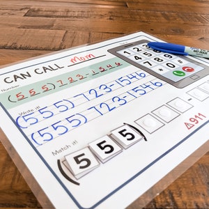 May include: A printable worksheet for learning to dial a phone number. The worksheet has a picture of a cell phone with a number pad and a section for writing the phone number. The number is (555) 723-1546. The worksheet also has a section for matching the numbers with the phone pad.