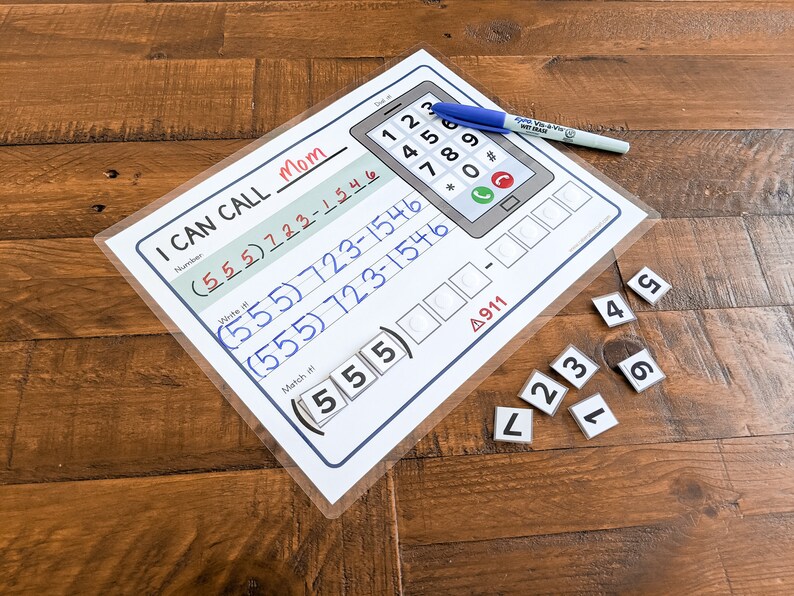 May include: A white and blue printable phone activity sheet with the text "I Can Call Mom" and a phone with a number pad. The sheet includes a section for writing phone numbers and a section for matching numbers. There are also small white squares with numbers on them.