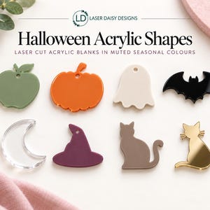 May include: A collection of eight laser-cut acrylic shapes for Halloween, including an olive apple, orange pumpkin, cream ghost, black bat, clear crescent moon, purple witch hat, brown cat, and a gold mirror cat, each featuring a small hole for hanging.