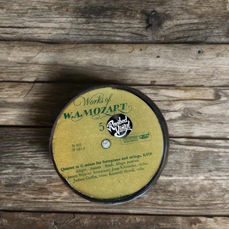 Bottom of coaster is the center of a damaged vinyl record that I cut out and upcycled.
