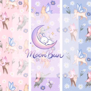 Peut inclure: Un motif fantaisiste avec des chats ailés, des ailes de papillon, des marguerites et un lapin endormi sur un croissant de lune. Les couleurs sont rose, violet et bleu, avec le texte "Moon Bun Studio".