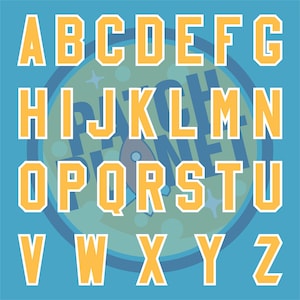 May include: A full alphabet in a bold, blocky font, with each letter outlined in white and filled with a golden-yellow color. The letters are arranged on a light blue background with a circular design in the center.