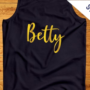 May include: A dark blue tank top with the name "Betty" written in gold script.