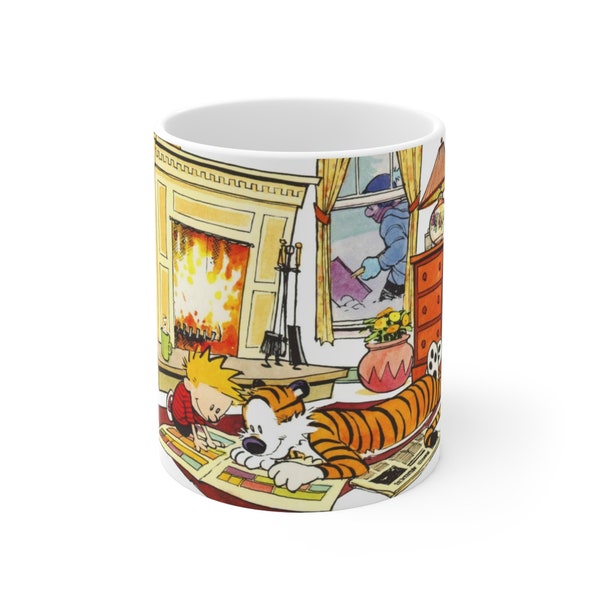 Calvin and hobbes reading comic strips at home by the fireplace Ceramic Mug 11oz winter gift mens womens anniversary birthday