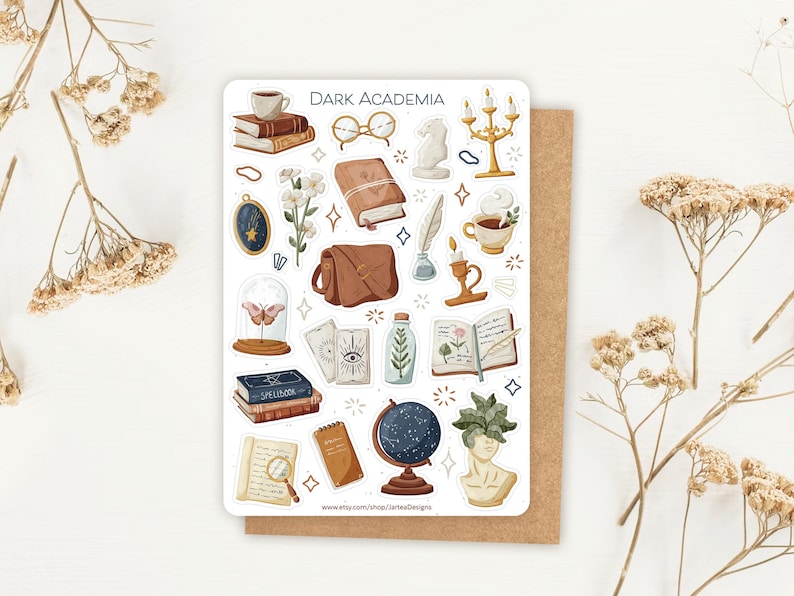 May include: A sticker sheet titled DARK ACADEMIA featuring illustrations of books, a coffee cup, glasses, a candle holder, a satchel, a quill, a moth in a glass dome, tarot cards, a globe, and a bust with leaves, all in a muted, earthy color palette.