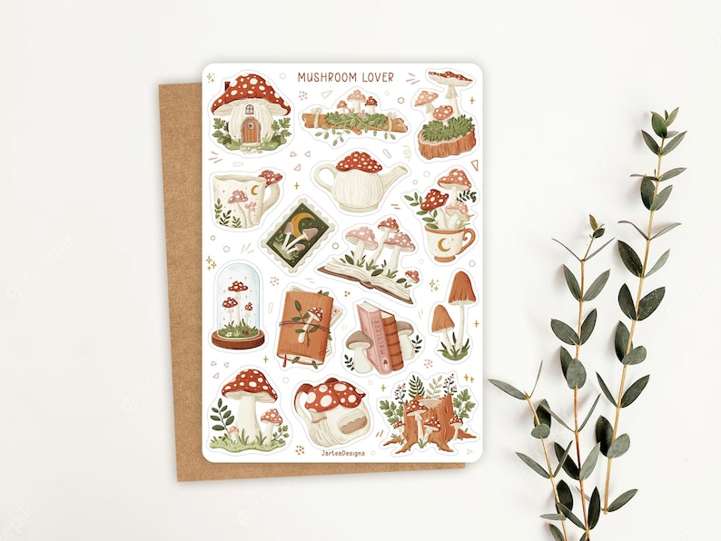 May include: A sticker sheet titled MUSHROOM LOVER featuring various illustrations of red and white mushrooms, including a mushroom house, a teapot, mugs, books, a glass dome, and a tree stump, all rendered in a soft, earthy color palette.