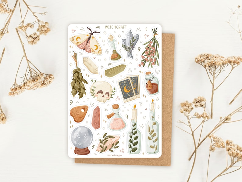 May include: A sticker sheet titled WITCHCRAFT featuring illustrations of a moth, crystals, a skull, tarot cards, potion bottles, candles, herbs, and a crystal ball. The sheet includes various botanical and mystical elements in soft, muted tones.