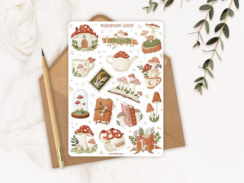 May include: A rectangular sticker sheet titled MUSHROOM LOVER featuring various illustrations of red and white mushrooms, including a mushroom house, a teapot, books, mugs, and a glass cloche. The sheet includes the text JartesDesigns at the bottom.